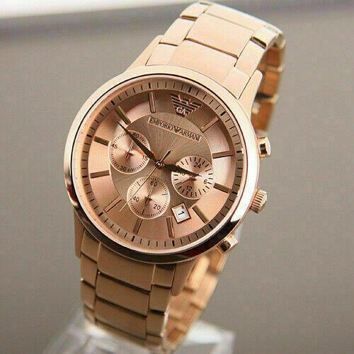 Rose gold chronograph watch at angle showing dial detail with subdials and steel bracelet