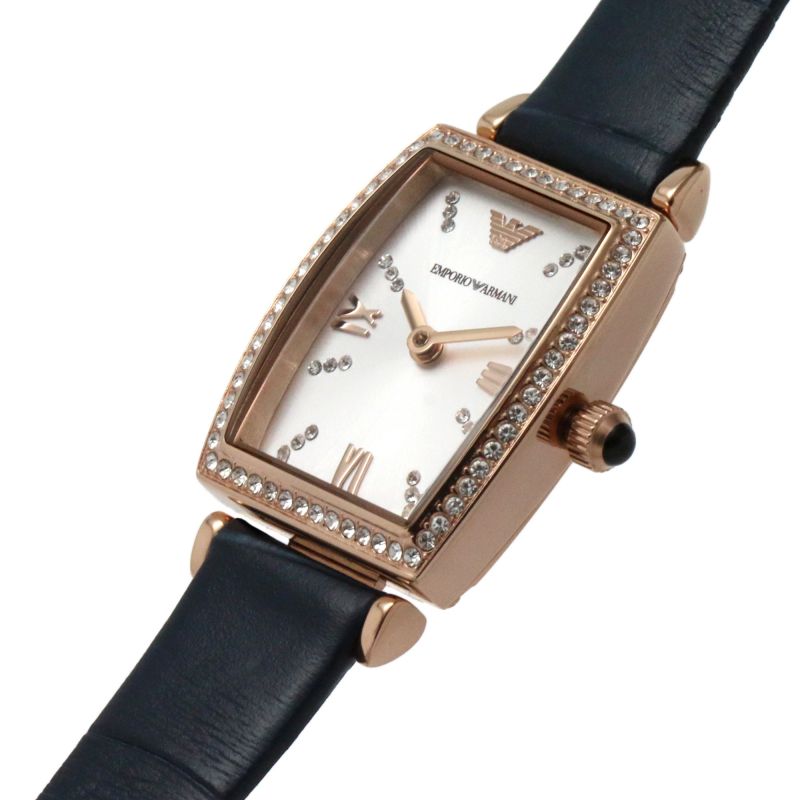 Angled view of Emporio Armani Gianni T-Bar watch showing rose gold tonneau case with crystal bezel and navy strap