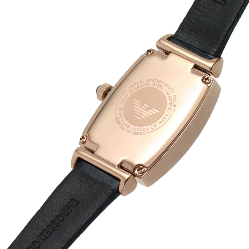 Caseback of Emporio Armani Gianni T-Bar watch showing engraved eagle logo and specifications on rose gold tonneau case