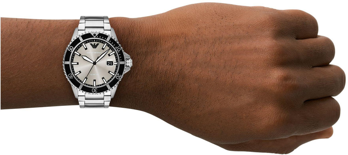 World Explorer stainless steel watch worn on wrist showing dial and bracelet fit
